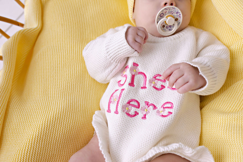 "She's Here" Floral Knit Romper Snow
