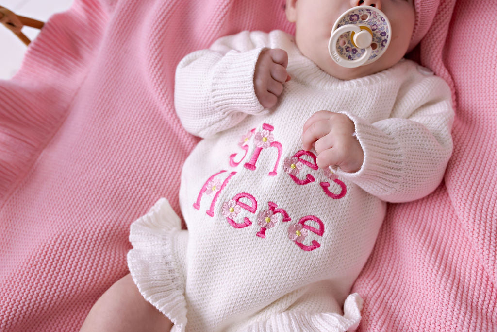 "She's Here" Floral Knit Romper Snow