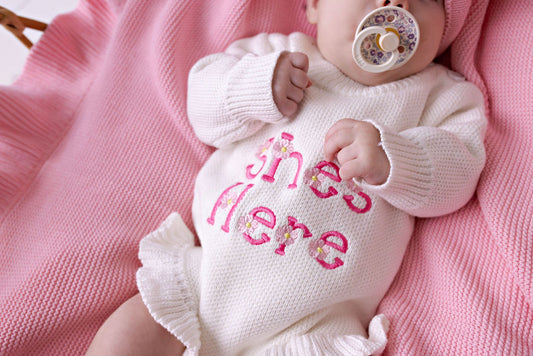 "She's Here" Floral Knit Romper Snow