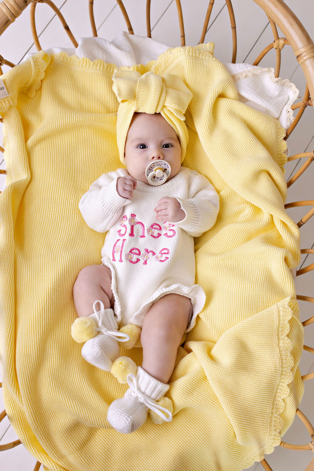 "She's Here" Floral Knit Romper Snow